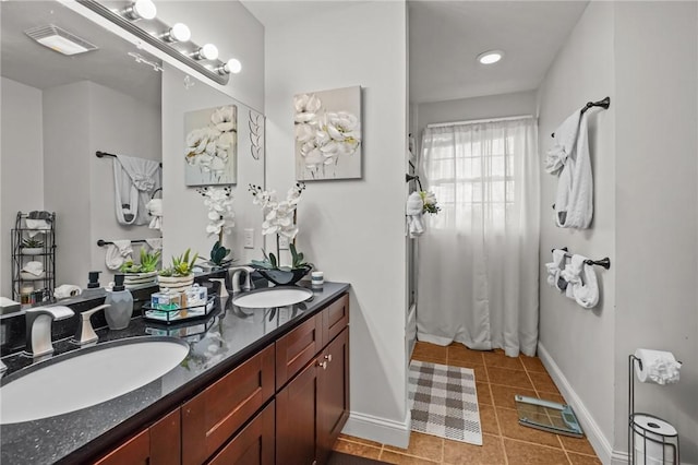 bathroom with tile patterned floors, shower / washtub combination, and vanity