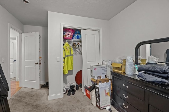 bedroom featuring light colored carpet