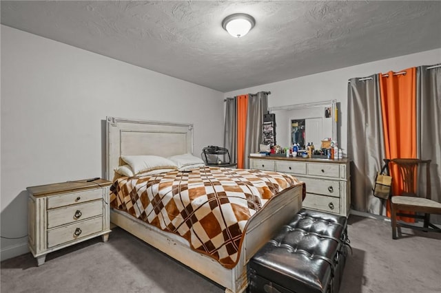 carpeted bedroom featuring a textured ceiling