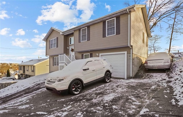 bi-level home featuring a garage