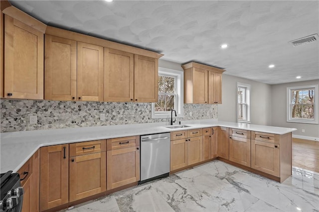 kitchen with kitchen peninsula, backsplash, stainless steel dishwasher, black range with electric cooktop, and sink