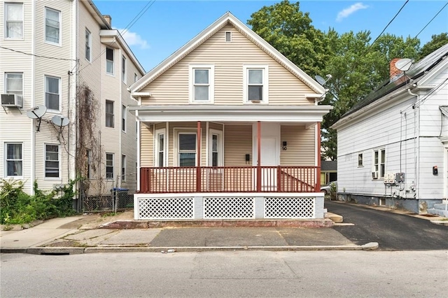 view of front of house featuring covered porch and cooling unit