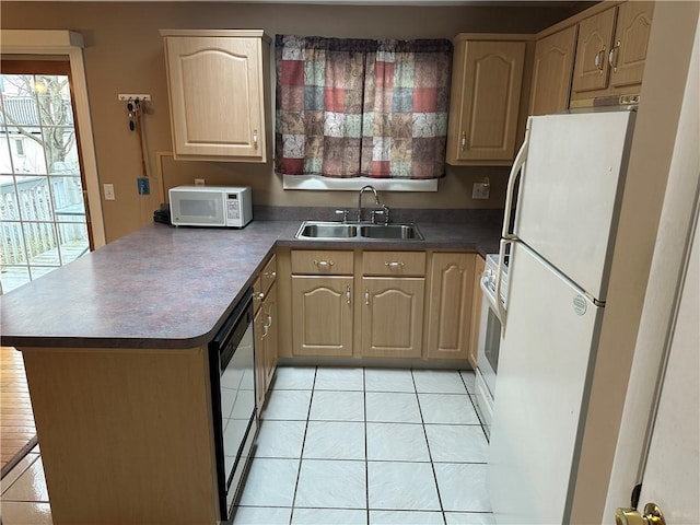 kitchen with light tile patterned flooring, white appliances, sink, and light brown cabinets