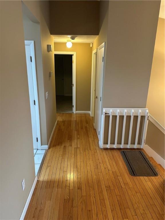 hallway with light wood-type flooring