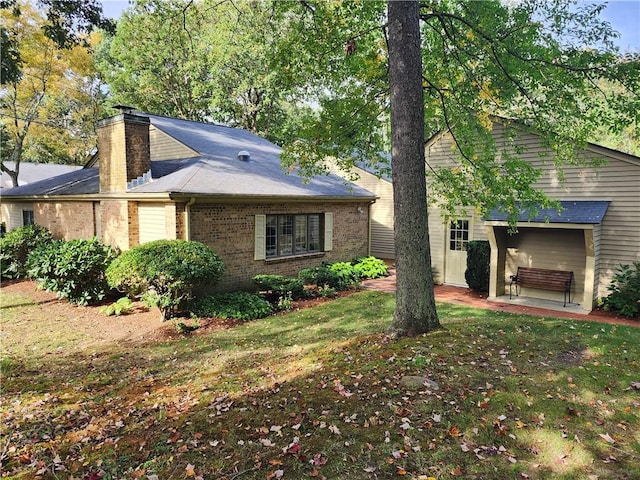 view of home's exterior featuring a yard