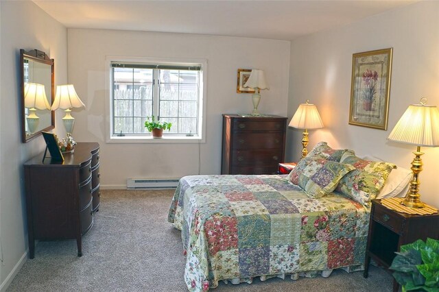 bedroom featuring baseboards, carpet floors, and a baseboard radiator
