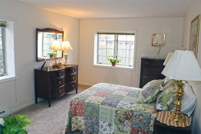 carpeted bedroom featuring baseboards