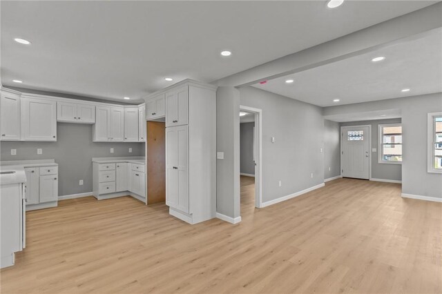 kitchen featuring light hardwood / wood-style floors and white cabinetry