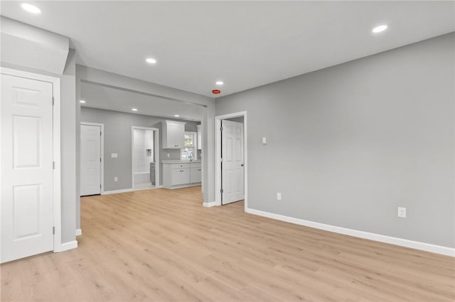 unfurnished living room featuring light hardwood / wood-style floors