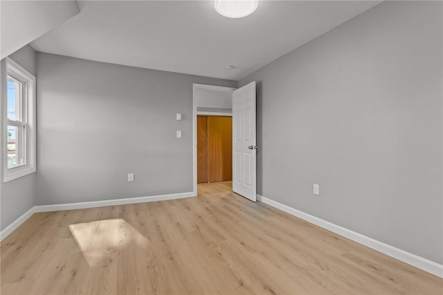 spare room featuring light hardwood / wood-style flooring