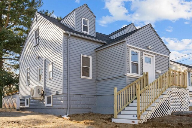 back of house featuring ac unit