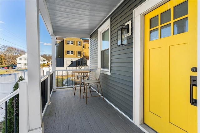 wooden terrace with a porch