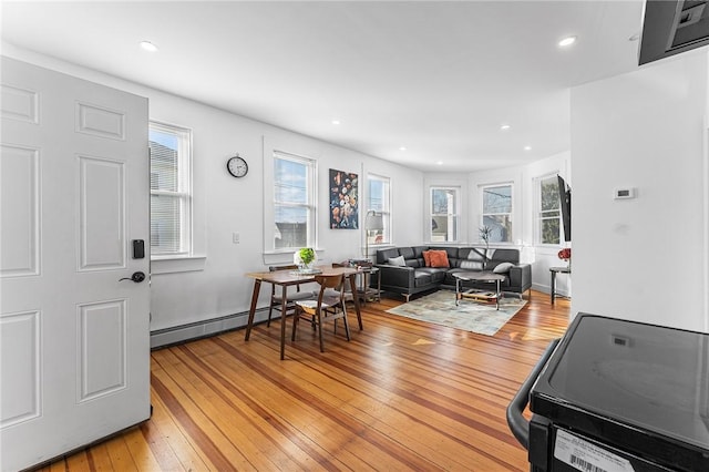 living room featuring light hardwood / wood-style floors and baseboard heating