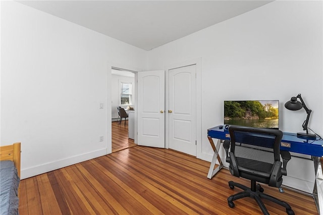 office area with wood-type flooring