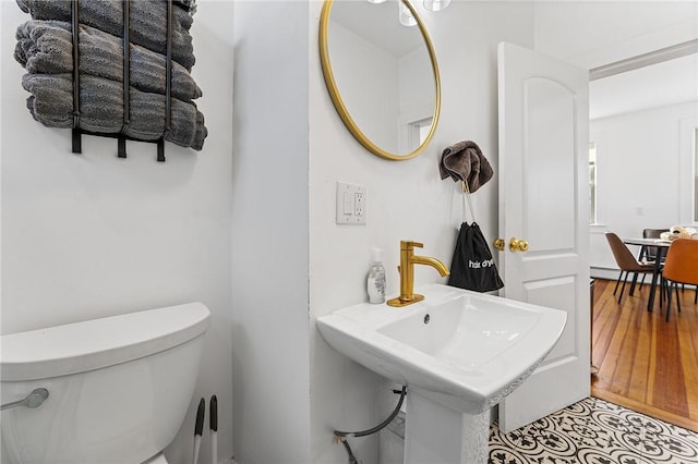 bathroom with tile patterned floors and toilet