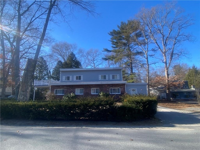 traditional home featuring brick siding