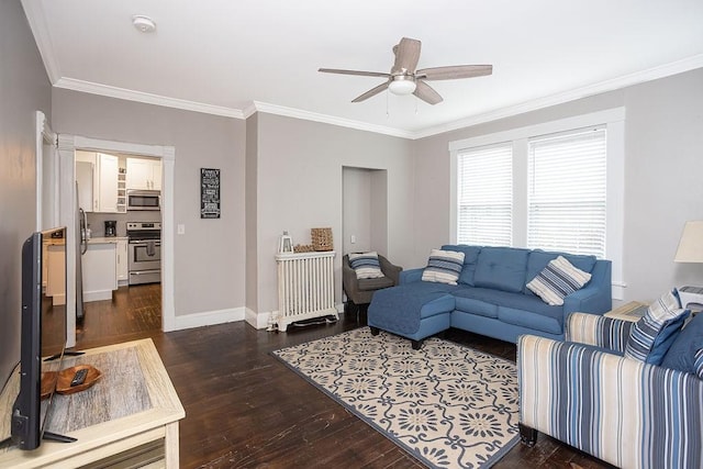 living room with ornamental molding, ceiling fan, and dark wood-type flooring