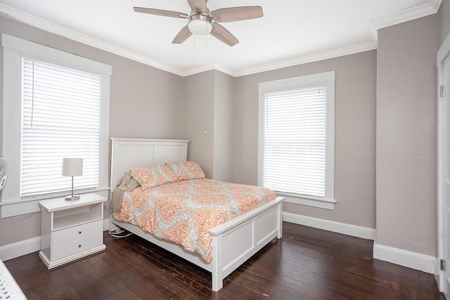 bedroom featuring ceiling fan, dark hardwood / wood-style flooring, and crown molding