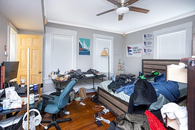 bedroom featuring ceiling fan and crown molding