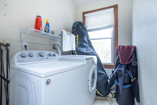 clothes washing area featuring washing machine and clothes dryer