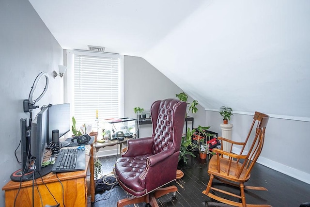 living area featuring dark hardwood / wood-style flooring and vaulted ceiling