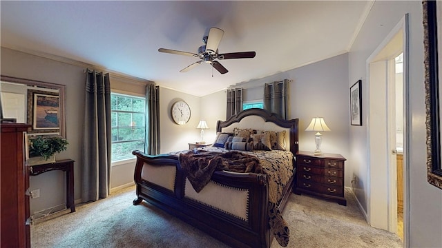 bedroom featuring ceiling fan, crown molding, light carpet, and vaulted ceiling