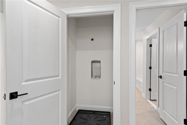 corridor featuring light tile patterned floors