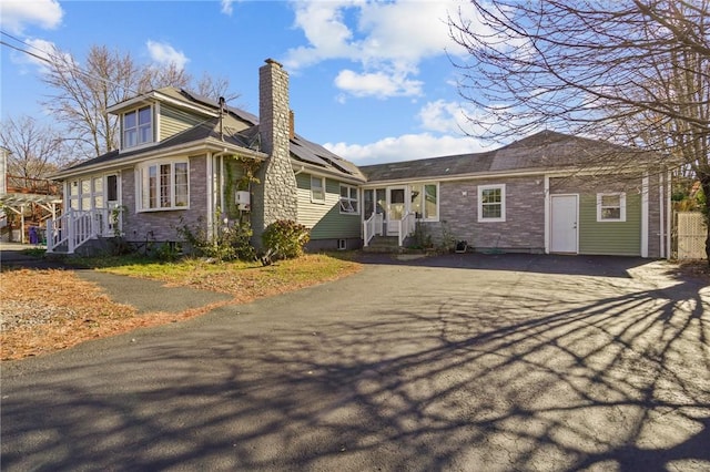 view of front of home featuring solar panels