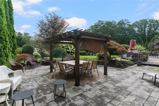 view of patio / terrace featuring a pergola and an outdoor living space with a fire pit