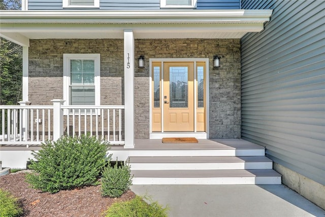 property entrance featuring a porch