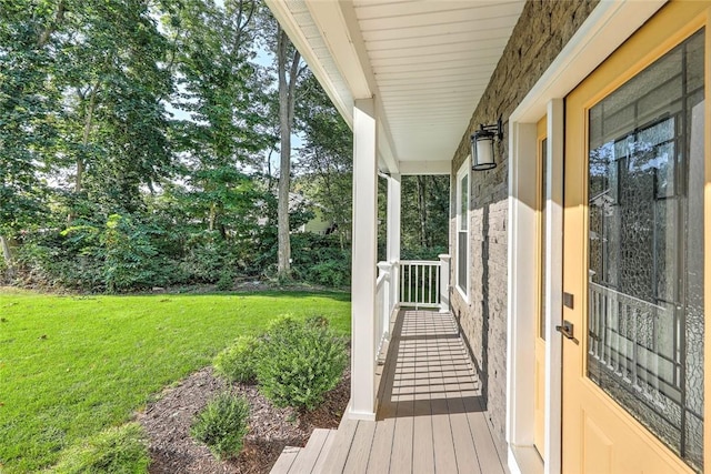 wooden deck with a yard