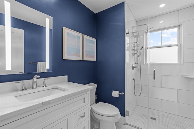 bathroom with tile patterned floors, vanity, toilet, and an enclosed shower