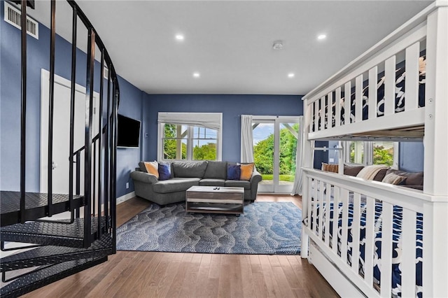 bedroom with dark wood-type flooring