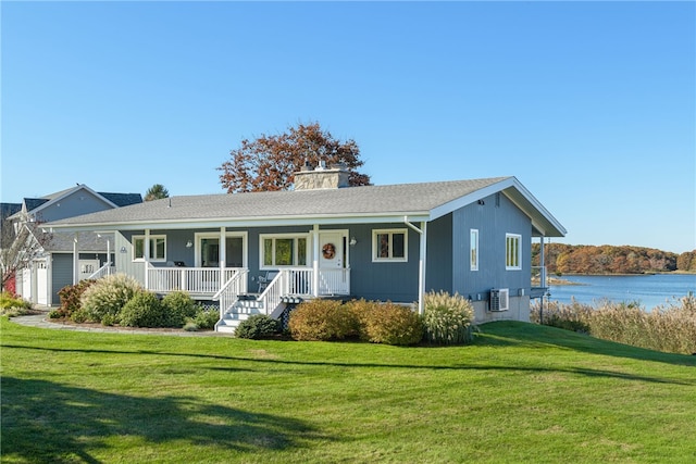 ranch-style home featuring a water view, covered porch, and a front yard