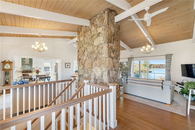 hallway with a notable chandelier, lofted ceiling with beams, wood ceiling, and hardwood / wood-style flooring