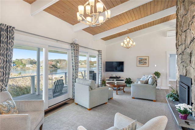 living room with a wall mounted AC, a fireplace, beamed ceiling, and high vaulted ceiling