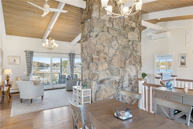 dining area with beam ceiling, a wall mounted AC, a wealth of natural light, and wooden ceiling