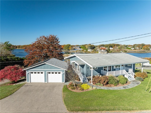 ranch-style house with a water view, a front lawn, and a porch