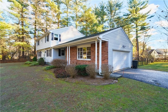 view of front of home featuring a porch, a garage, and a front lawn