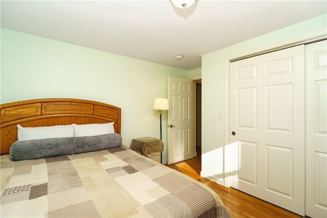 bedroom featuring a closet and light hardwood / wood-style flooring