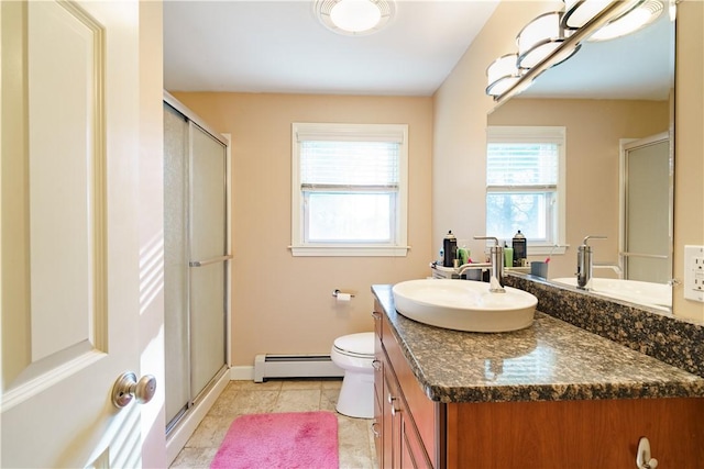 bathroom with vanity, a baseboard heating unit, tile patterned flooring, toilet, and a shower with shower door