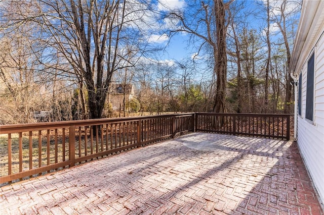 wooden terrace featuring a patio area