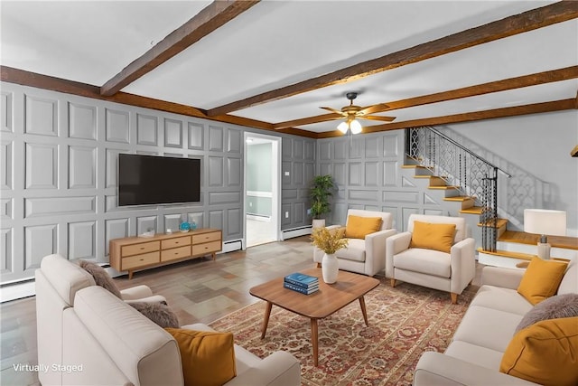 living room featuring ceiling fan, beam ceiling, and baseboard heating