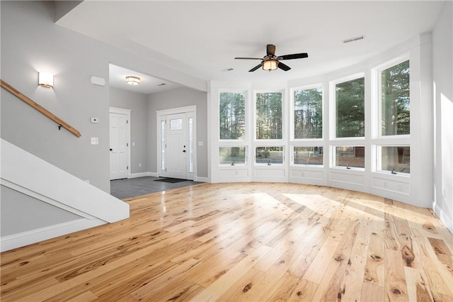 interior space with light hardwood / wood-style floors and ceiling fan