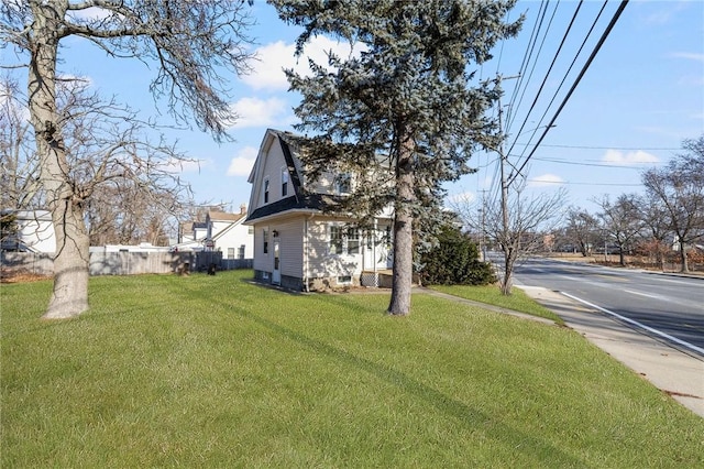 view of home's exterior featuring a yard