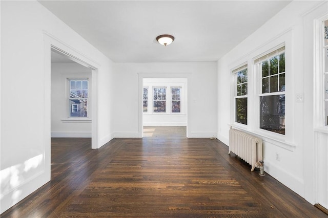 interior space featuring radiator and dark hardwood / wood-style flooring