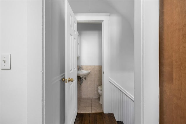 interior space featuring hardwood / wood-style flooring and toilet