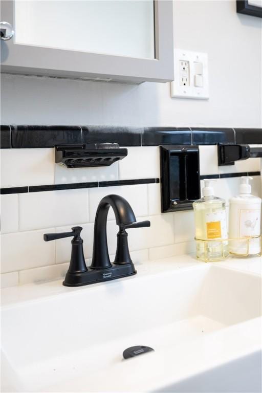 interior details with sink and tasteful backsplash