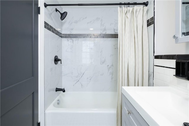 bathroom featuring vanity, tasteful backsplash, and shower / tub combo with curtain