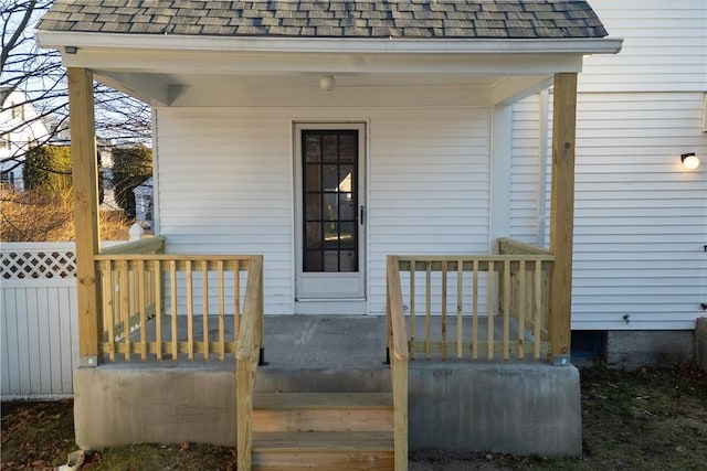 view of exterior entry featuring a porch